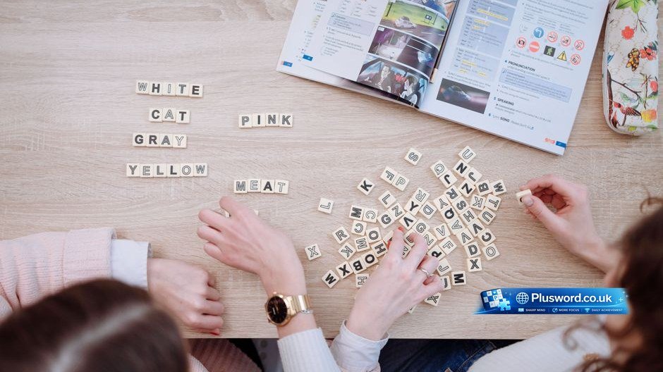 A person applying practical word puzzle strategies on a newspaper and digital tablet