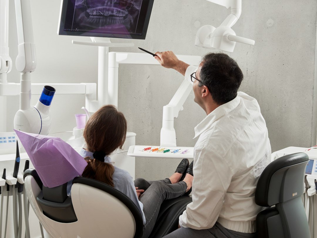 Dentist discussing a dental treatment estimate with a patient