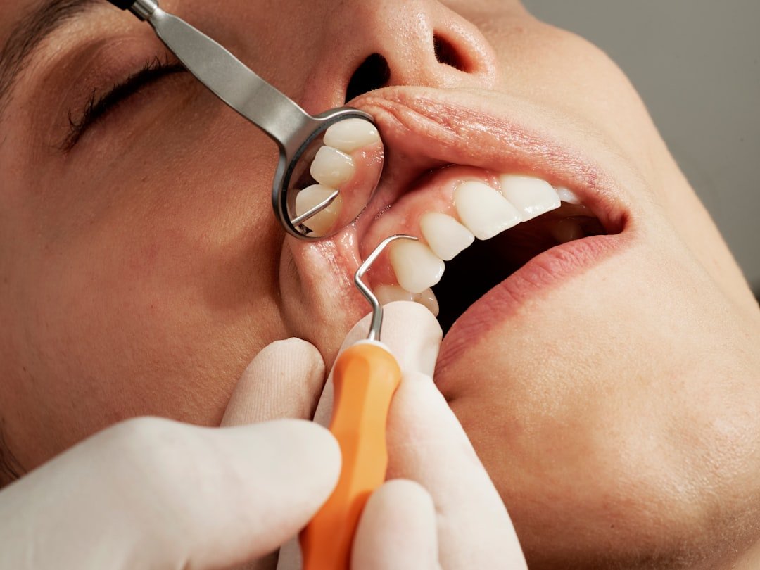 Dentist examining a patient’s teeth during an oral health checkup