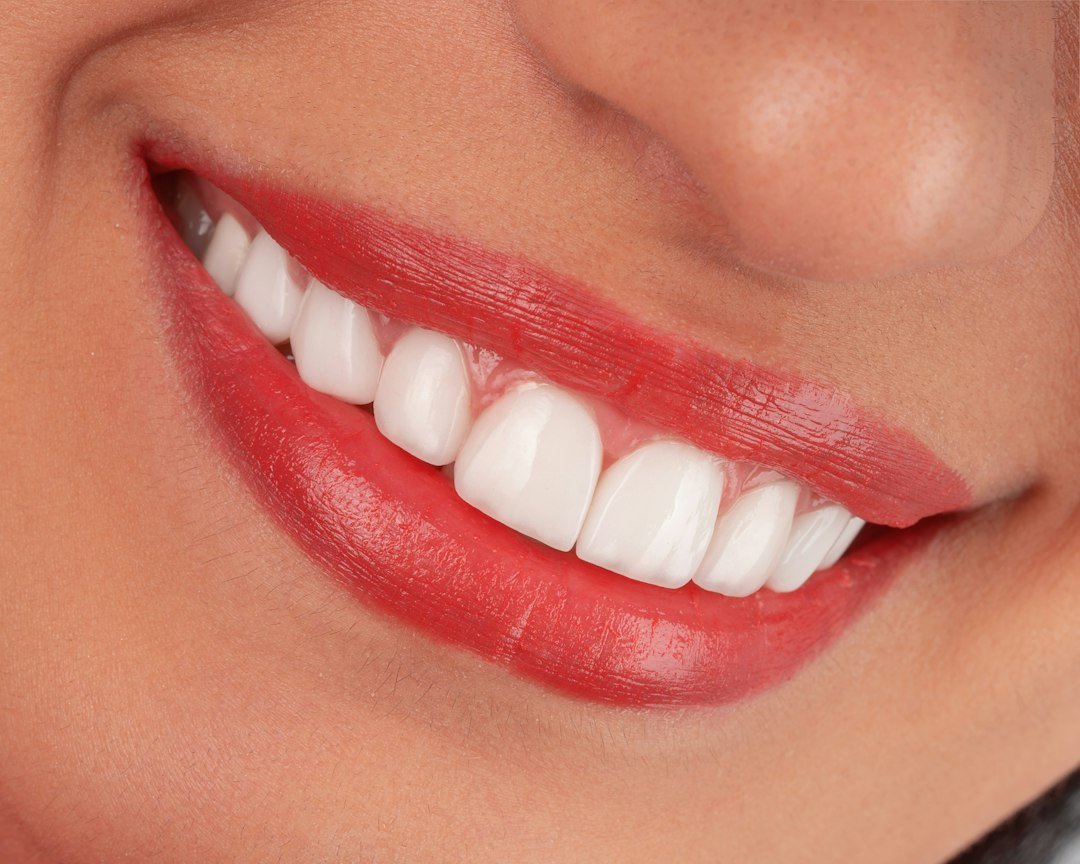 Person brushing teeth as part of a preventive dental care routine